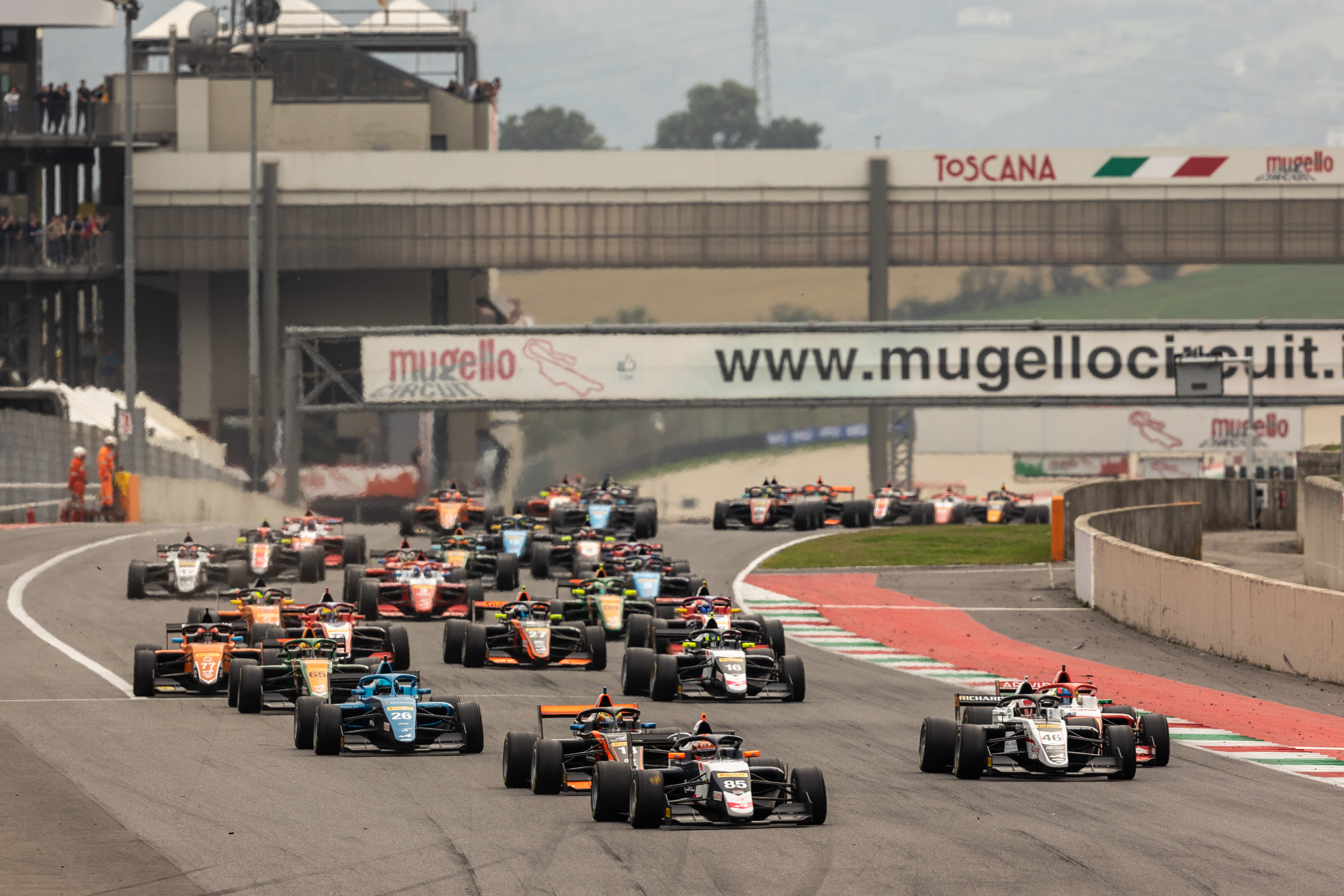 Front view of 34 FRECA cars racing down the start-finish straight at Mugello