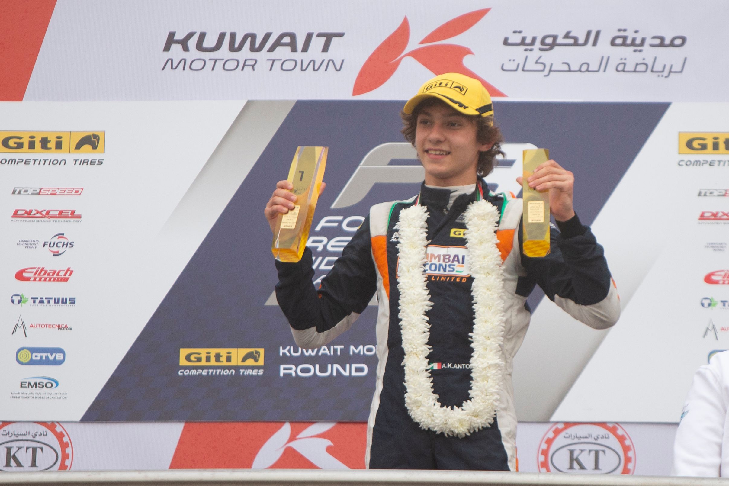 Kimi Antonelli celebrating on the podium in Kuwait