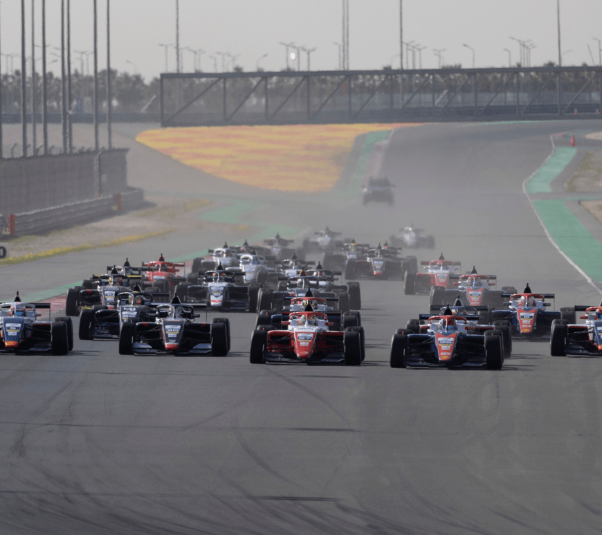 Cars on track at Kuwait coming towards the camera