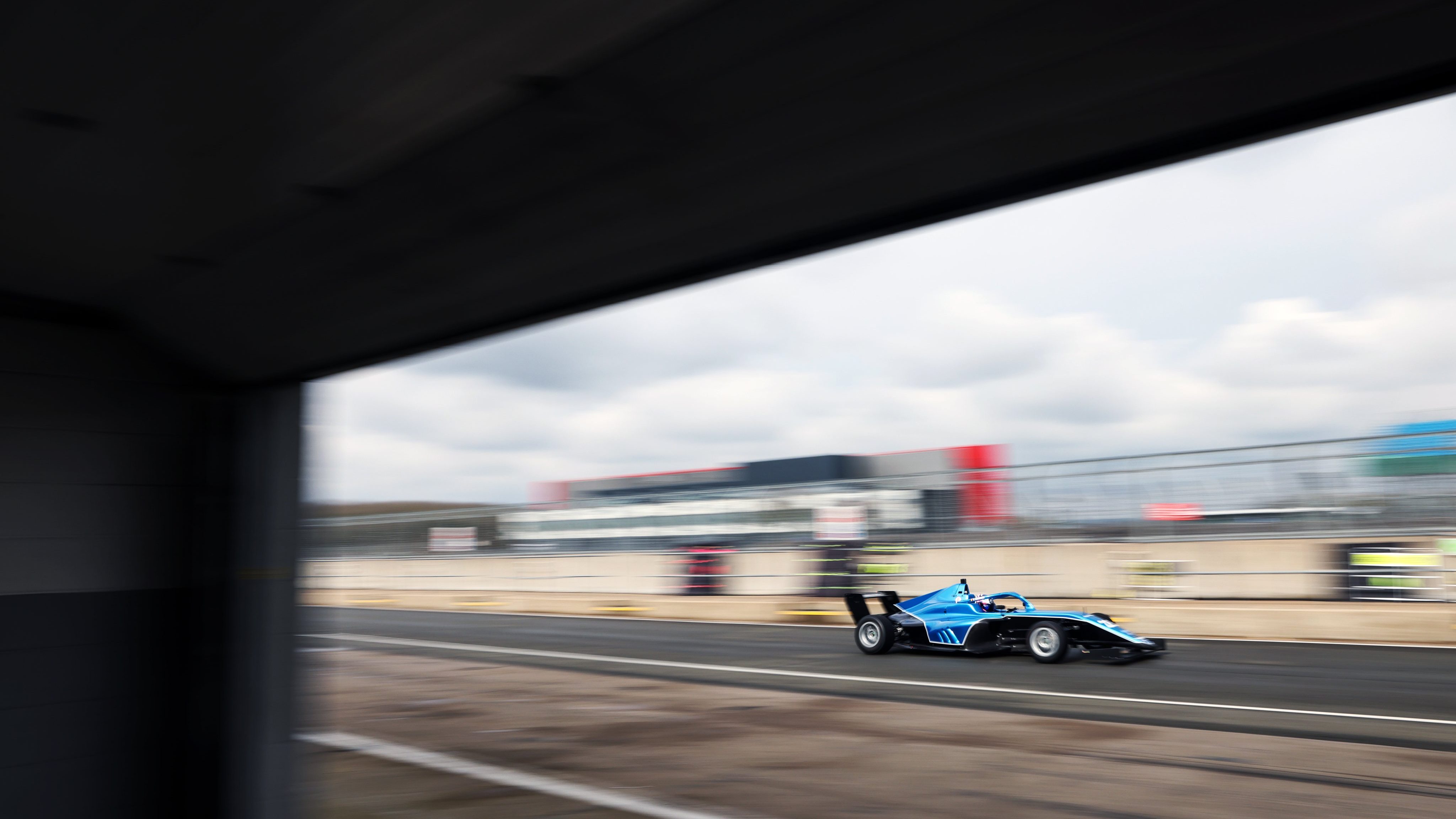 Blue car on track 