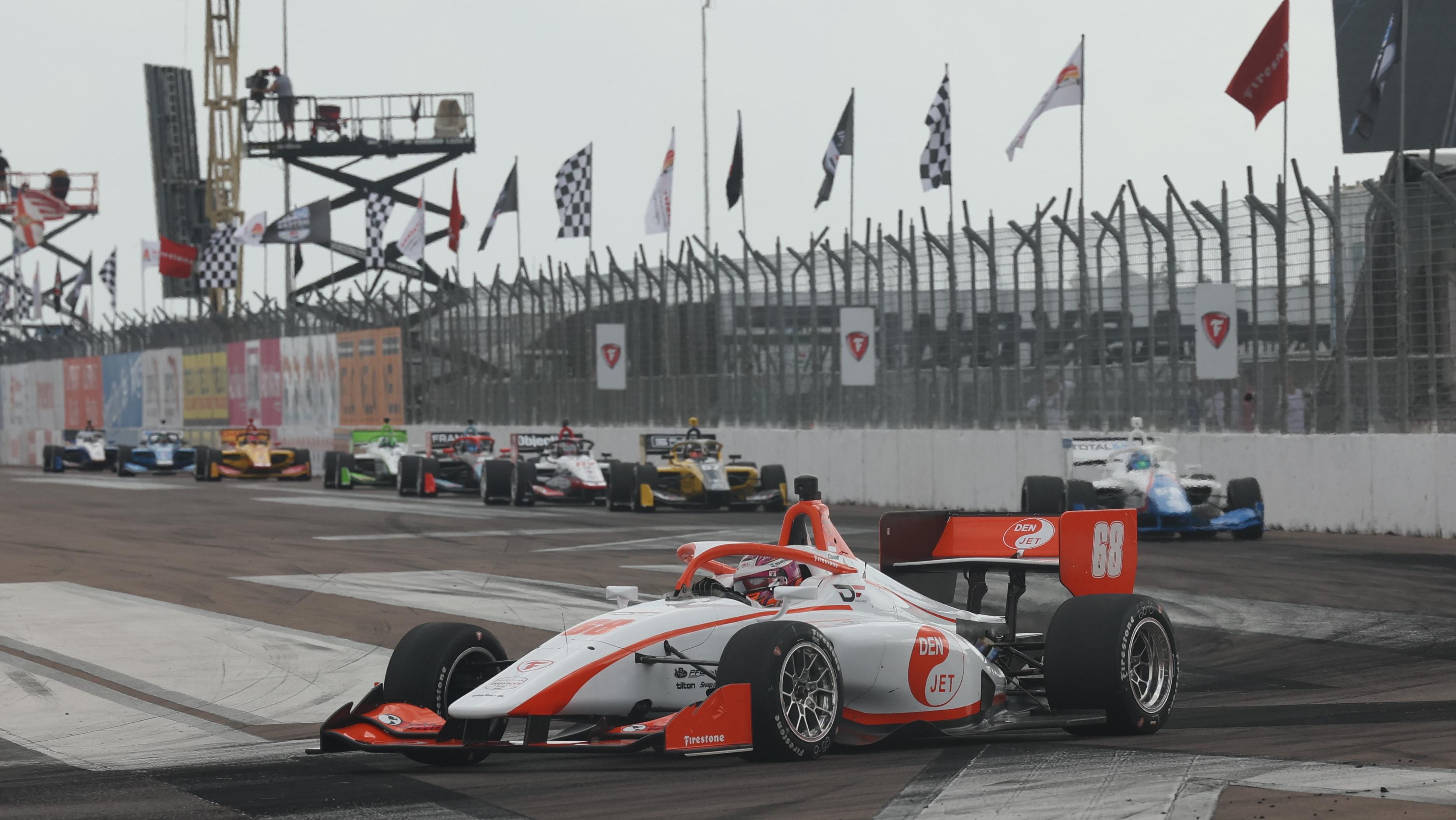 Red and white car on track
