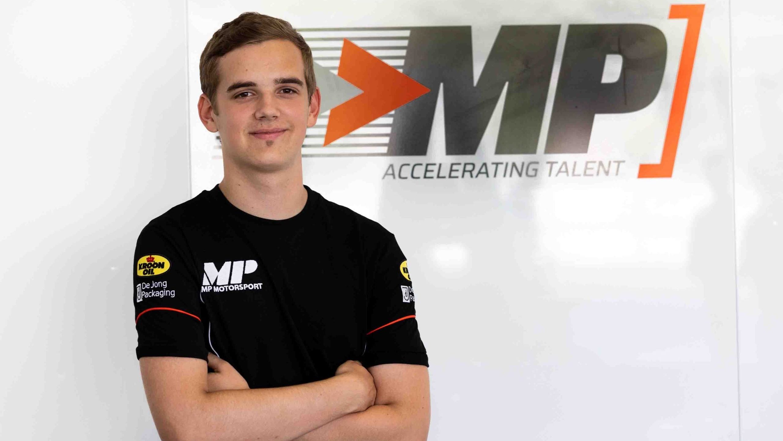 Jonny Edgar in a black MP Motorsport t-shirt with the logo in the background.