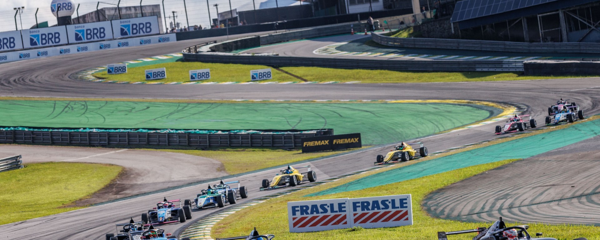 Cars rounding the Senna S at Interlagos, photographed from Turn 3