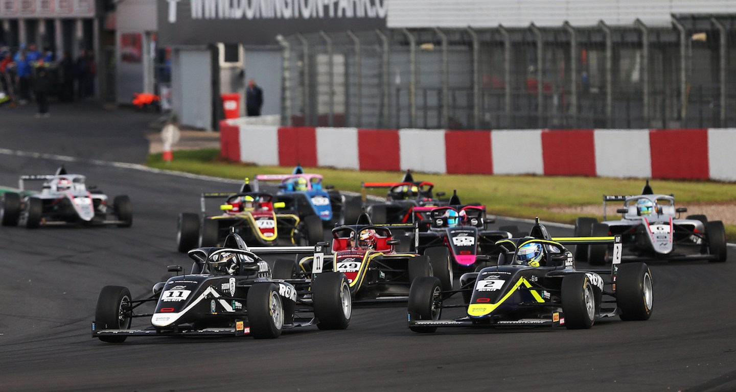 British Fr cars turning right at Turn 1 of Donington Park