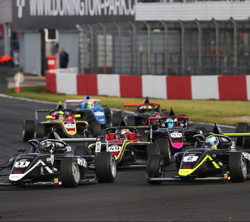British Fr cars turning right at Turn 1 of Donington Park