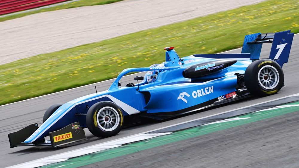 A blue car shot from the left