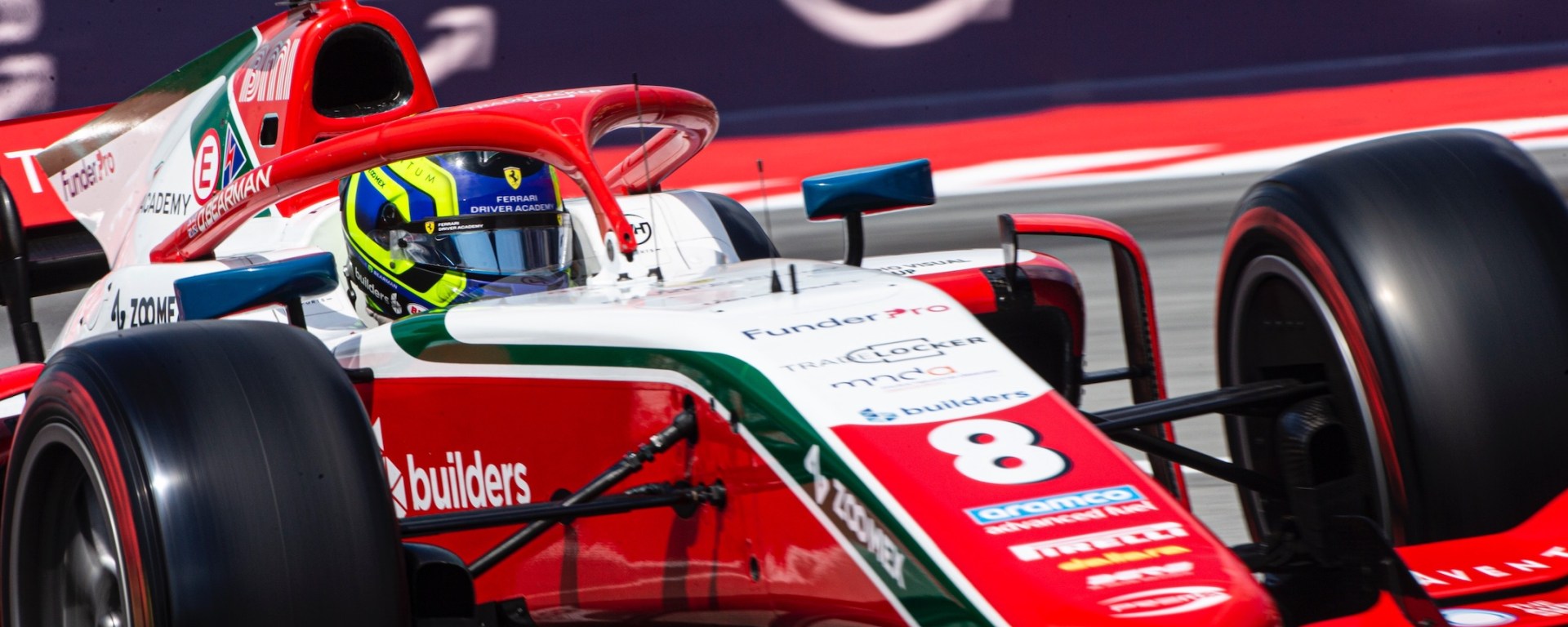 Red and white Prema of Ollie Bearman close-up