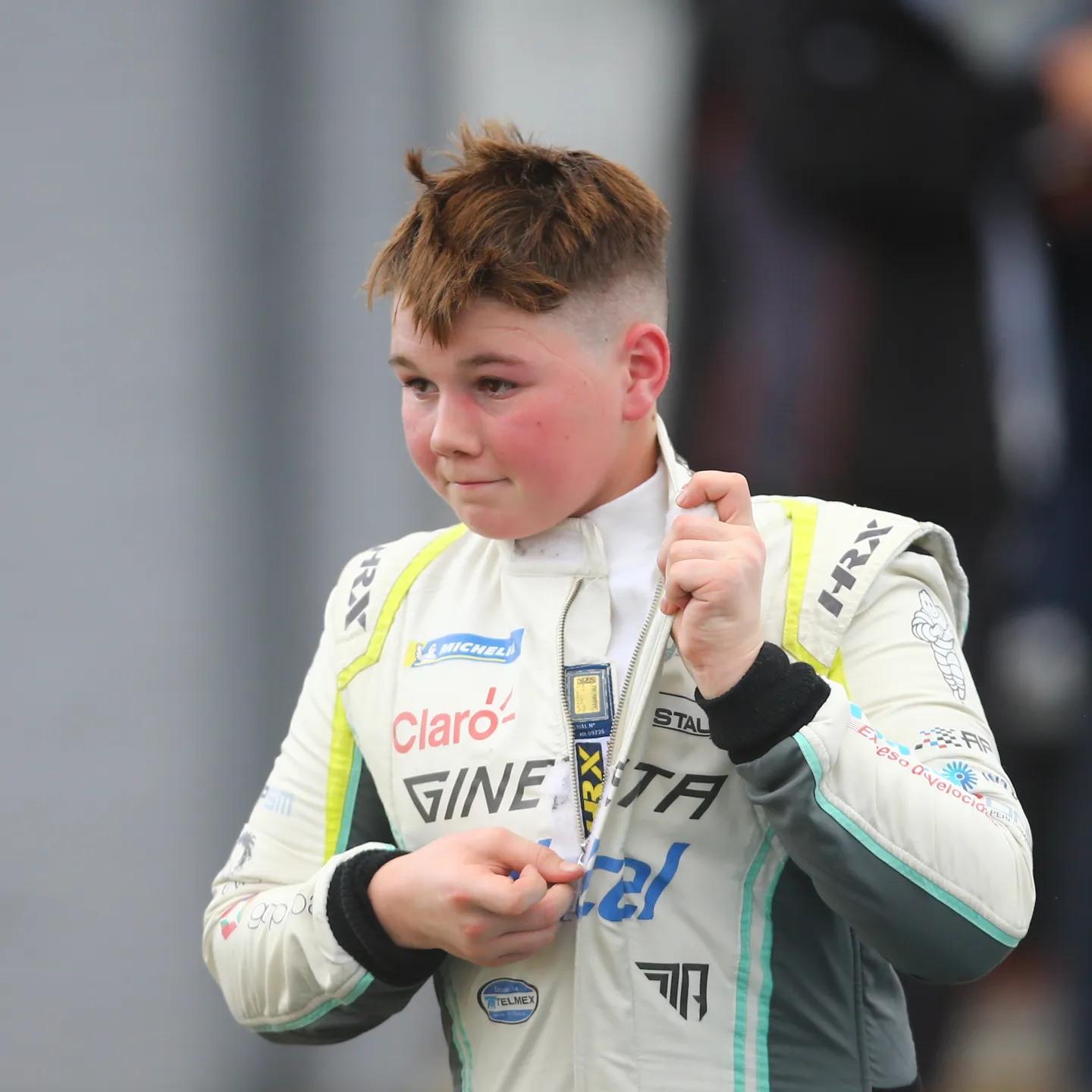 A child in a race suit
AI-generated content may be incorrect.