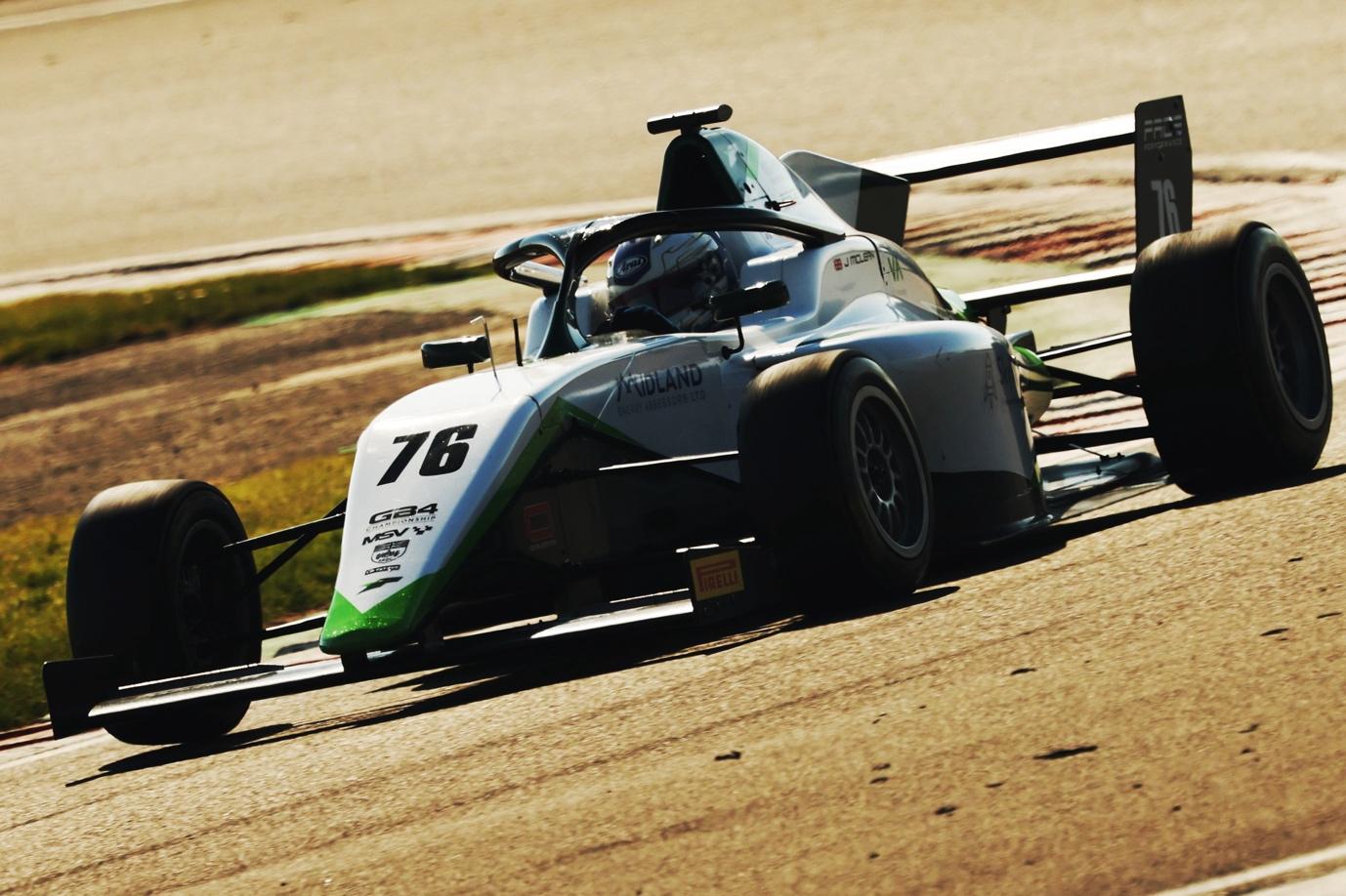 A race car on a track

AI-generated content may be incorrect.