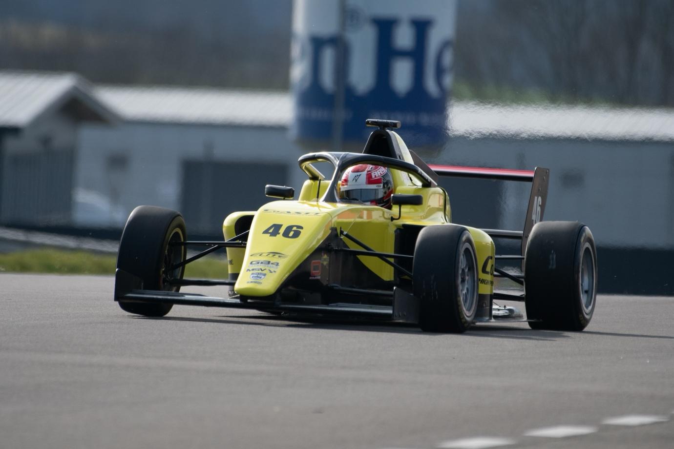 A yellow race car on a track

AI-generated content may be incorrect.